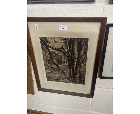 A etching of a woodland scene with cabins and mountains beyond, framed and glazed