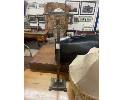 A brass stand and a selection of light shades
