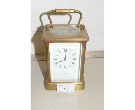 A brass cased carriage clock, the dial marked Goldsmiths Company, 112 Regent Street, London