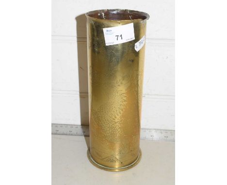 A vintage brass trench art shell case dated 1917