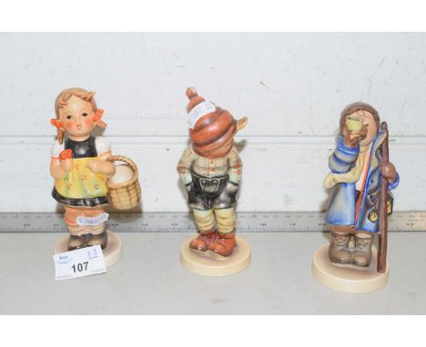 A group of three Goebel figures