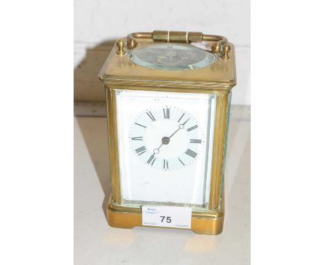 A French brass cased carriage clock with coloured enamelled dial