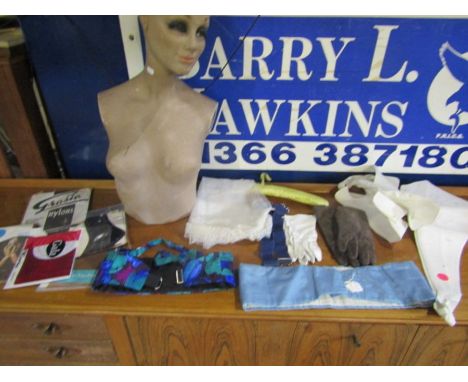 A vintage mannequin, nylon tights/stockings, vintage wedding veil, gloves, belts etc