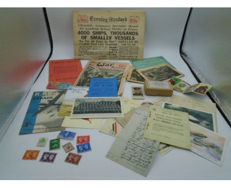 A collection of replica first and second world War related ephemera and a replica 'Acme Clicker' in a box, also 9 used stamps