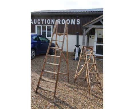 Two vintage wooden folding decorators step ladders, the largest approx 200cm high, the other with metal plaque reading ' The 