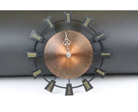 Planished copper &amp; iron battery-operated wall clock with applied brass Roman numerals, approx 37.5cm diameter 