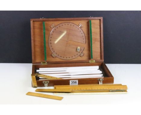 A collection of vintage boxwood rulers to include Rabone folding examples together with a surveyors measuring set. 