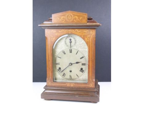 Early 20th century inlaid mahogany Westminster chiming mantel clock, the engraved arched dial with Roman numerals and chime /