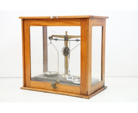 Set of 20th Century Griffin &amp; Tatlock brass balance scales, housed within a glazed wooden case. Approx 45.5cm W x 43cm H 