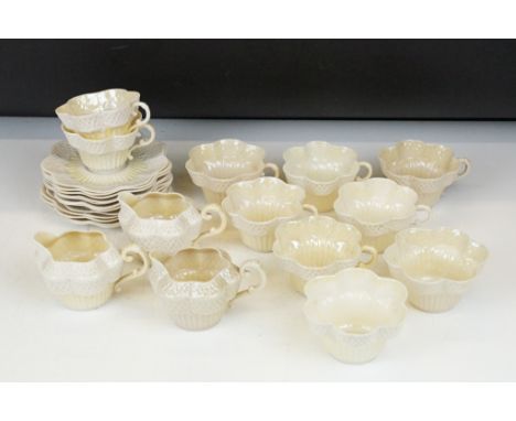 Belleek Cream Cob Lustre tea ware, first and second period, to include 8 cups, 12 saucers, 3 milk jugs and 2 sugar bowls. 