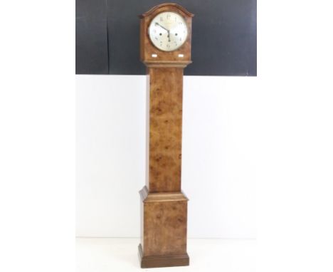 Early 20th century Walnut Chiming Grandmother Clock, the domed hood with a silvered circular dial with Arabic numerals and ma