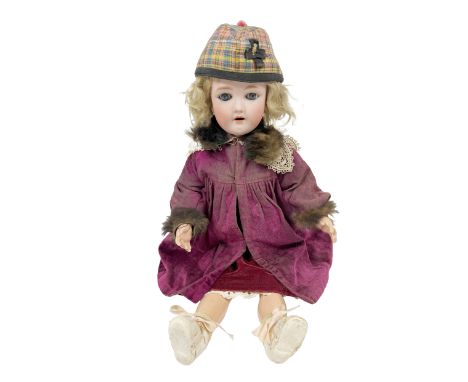 A German porcelain Doll, (stamped on back of head) with moving eyes, blonde hair, red dress with&nbsp;purple and lace overcoa