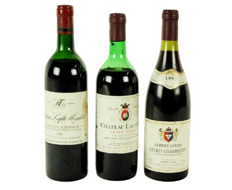 Wines: A bottle of Chateau Lalande Saint-Julien, 1983; a bottle of Chateau Lafite Monteil, Bordeaux Superior, 1986; and a bot