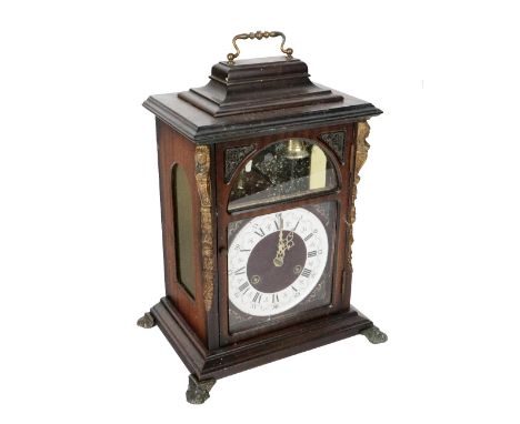 A Georgian style mahogany Bracket Clock, with brass carrying handle, the face with exposed chime above a circular dial with R