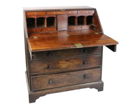 An Irish 19th Century mahogany Bureau, stamped J.Kerr &amp; Co., No. 68931, the slope front opening to reveal a fitted interi
