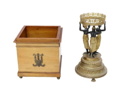 A Regency style bronze and gilt bronze Table Centre, modelled with three maidens holding a corona aloft on leaf moulded base 