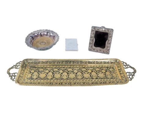 A silver Photograph Frame, 6 1/2" (16cms), a large silver plated magnum Wine Coaster or Cigarette Case, and an oblong Indian 