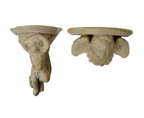 A composition demi-lune Wall Bracket, modelled with a cherub head with wings, 30cms (12"); together with another similar ditt