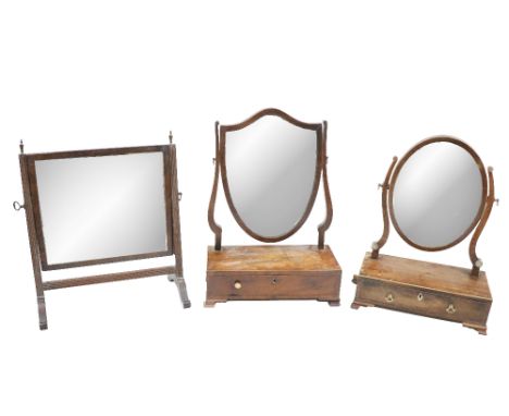 A late George mahogany swing frame Dressing Table Mirror, with oval plate and frieze drawer on ogee bracket feet, 13 3/4" (35