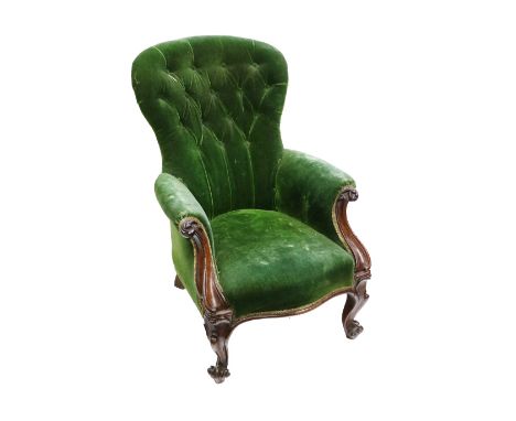 A Victorian mahogany button back Armchair, covered in green velvet on front cabriole legs. (1)