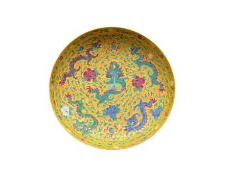 A fine early Chinese Imperial yellow porcelain Dish,&nbsp;with raised enamel features depicting five dragons with four and fi