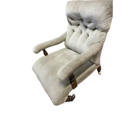A Victorian walnut Open Easy Armchair, with button back on front turned legs, covered with cream fabric. (1)