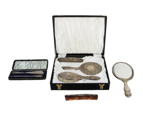 A cased silver backed Brush and Mirror Set, together with another Brush, Comb and Hand Mirror, and a cased Shoe Horn and Lace