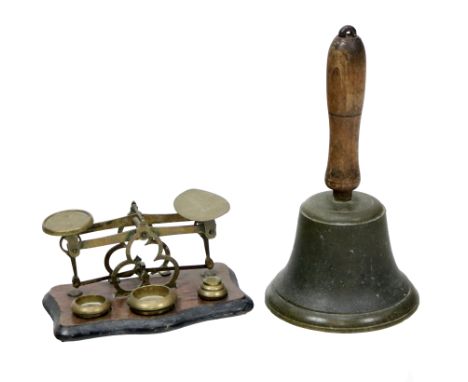 A wooden handled and brass School Bell;&nbsp;together with a brass Weighing Scales. (2)