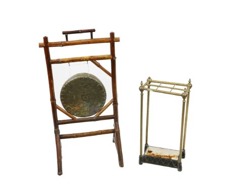 An assimilated bamboo framed Dinner Gong, with carrying handle; together with a brass Stick or Umbrella Stand; a 19th Century