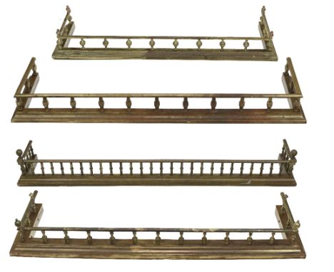 Four similar brass Fenders, each with attractive balustrade on moulded base, approx. 140cms (55"). (4)
