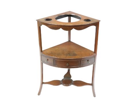 A 19th Century mahogany Corner Washstand, of low proportions, with open slot top over plain shelf with single frieze drawer o