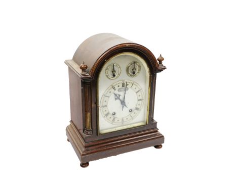 An early 20th Century mahogany chiming Mantle Clock, with arched and silverised dial with Roman &amp; Arabic numerals,&nbsp;s