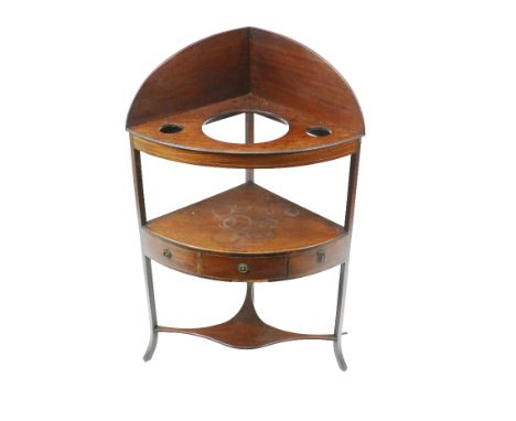 A George III period inlaid and crossbanded mahogany Corner Washstand, three tiers with gallery and a bow front, the center sh