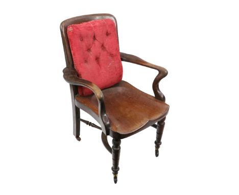 A late 19th Century / early 20th Century mahogany Library Chair, by James Shoolbred (Jas) with button back above a solid deep