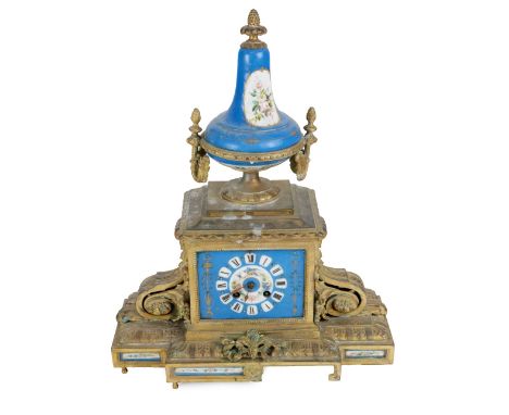 A late 19th Century French gilt Spelter Mantle Clock, with Serves style Celeste blue porcelain urn finial with two handles ab