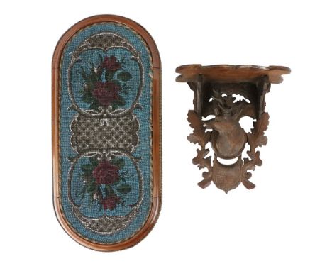A 19th Century brass mounted mahogany Table Stand, with bead tapestry centre in oblong moulded frame with bowed ends, 56cms (
