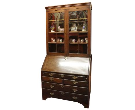 A Georgian mahogany slope front Bureau, with fitted interior, comprising drawers and pigeon holes above one long, two short a