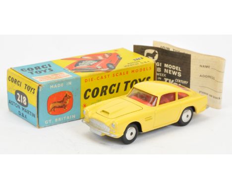 Corgi Toys 218 Aston Martin DB4 - yellow body with open vent, red interior, silver trim and flat spun hubs - Excellent (some 