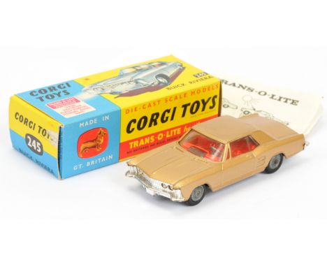 Corgi Toys 245 Buick Riviera - gold body, red interior, chrome trim, wire wheels,, grey plastic tow hook and "Trans-o-Lite" h