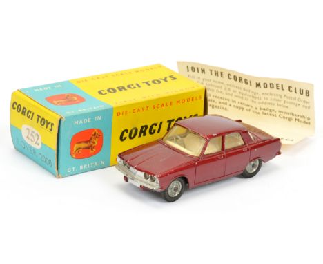 Corgi Toys 252 Rover 2000 - metallic maroon body, cream interior, silver trim, cast hubs and "Trans-o-Lite" headlights - Good