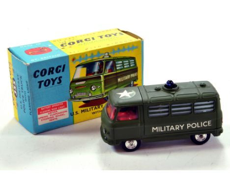 Corgi No. 355 Commer US Army Military Police Truck with military green body, red interior and driver figure. NM in VG to E Bo