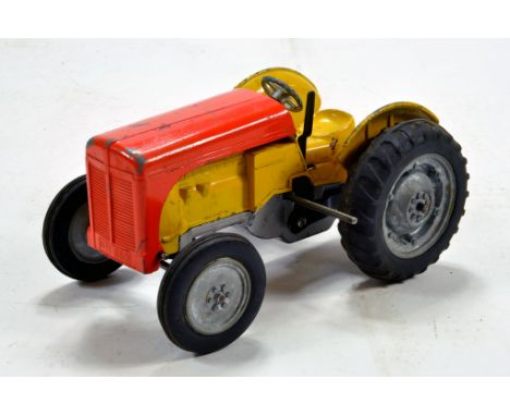 Mettoy No. 860 Ferguson Type Farm Tractor. Rare clockwork version in orange and yellow. Generally VG to E. 