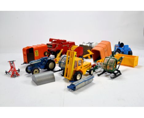 A group of mainly Britains Tractor and Implement items for spares repair. 