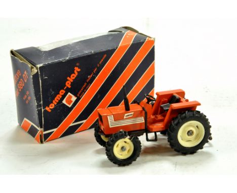 Forma-plast (Italy) 1/43 approx model of the Fiat 880 DT Tractor. Some tyre deterioraton otherwise G in Box.