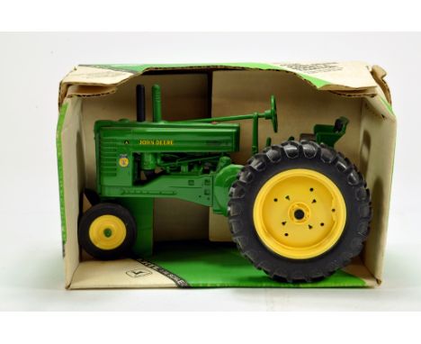 Ertl 1/16 diecast issue comprising John Deere Model A Tractor. E to NM to M in Box.