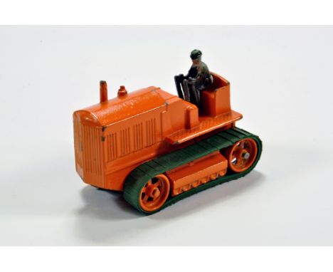 Moko clockwork Heavy Tractor finished in orange with orange metal rollers and green rubber tracks. Nice example is VG to E. 