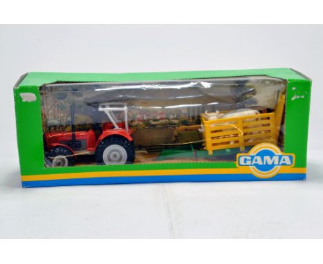 GAMA 1/30 diecast farm issue comprising Deutz Tractor (Orange) with trailer. E to NM to M in Box. Rare. 