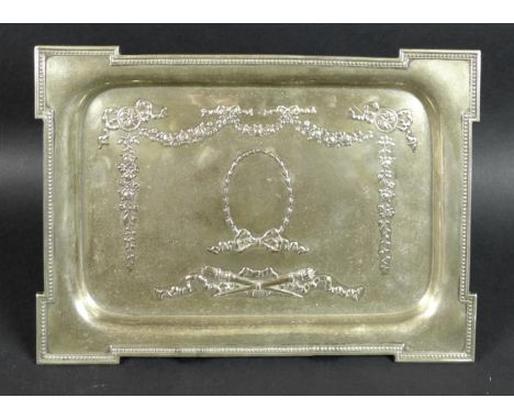 A George V rectangular silver tray, the body decorated with floral swags, bows, ribbons and torches, central vacant oval cart