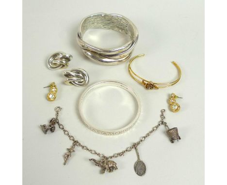 A collection of vintage and modern silver jewellery, including a silver bangle, the exterior of the band inscribed in latin '