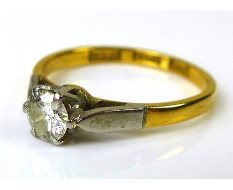 An 18ct gold and platinum diamond solitaire ring, approx 0.25ct diamond, platinum stylised leaf shoulders, band hallmarked, s